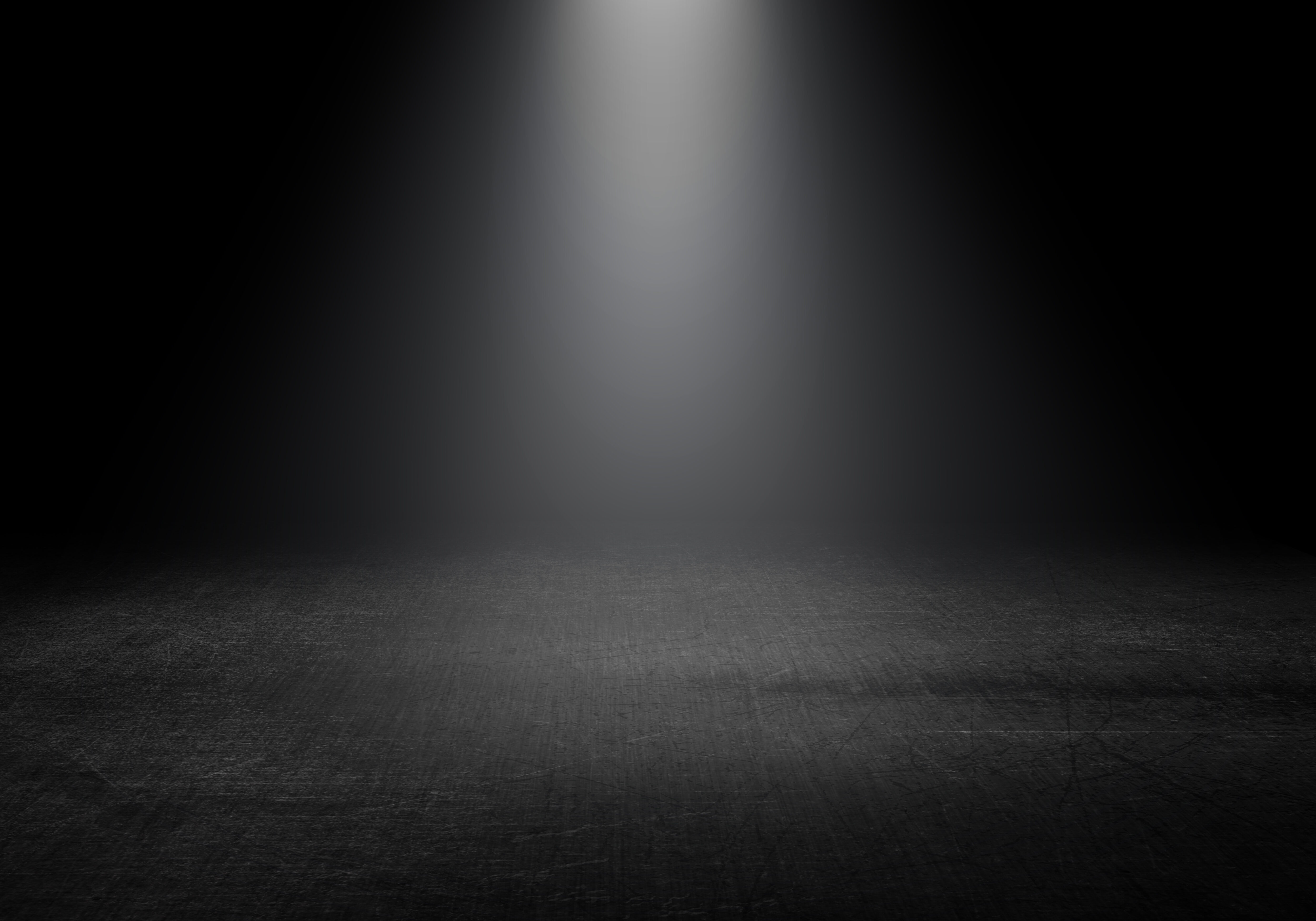 3D render of a spotlight shining down into a grunge interior